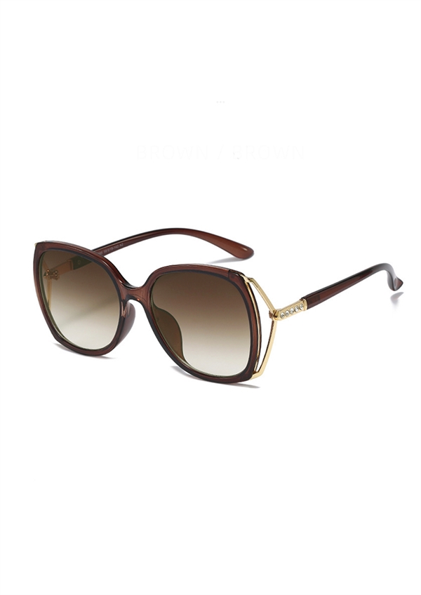 Skøn mørkebrun solbrille med guldfarvet brillestel fra Just D\'Lux