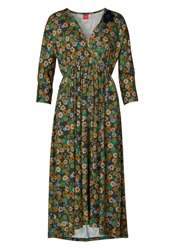 Skøn blomstret retro kjole, mørkeblå bund og print i varme grønlige nuancer fra du Milde